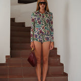 DUNIE - Long-sleeve stretch bodysuit with button-up front with belt detail