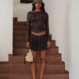 KAIA - Printed semi-sheer mesh mini skirt with ruffles and mother-of-pearl embellishments
